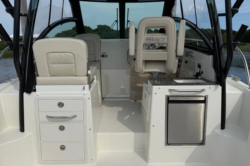 Slide: The Image of 2026 Boston Whaler 285 Conquest interior with seating and storage compartments. - 15