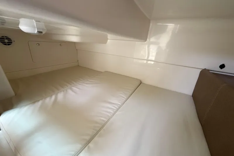 Slide: The Image of Interior cabin of 2026 Boston Whaler 285 Conquest with cushioned seating. - 37