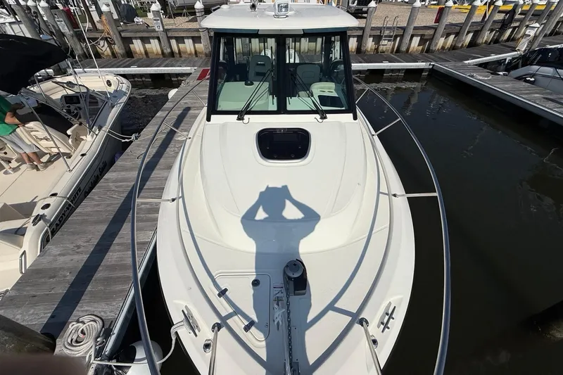 Slide: The Image of 2026 Boston Whaler 285 Conquest docked at marina, top view. - 39