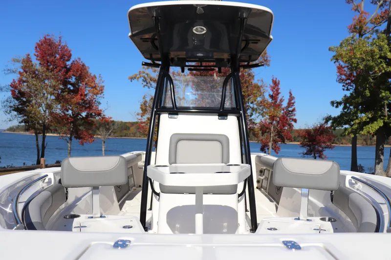 Slide: The Image of 2024 Sea Born LX24 Center Console boat on a lake with autumn trees. - 1