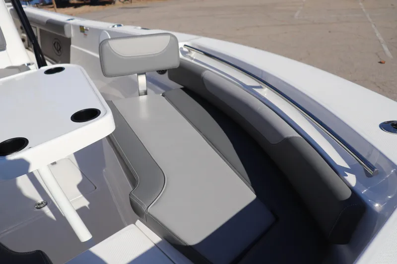Slide: The Image of 2024 Sea Born LX24 Center Console boat interior with seating and table. - 3