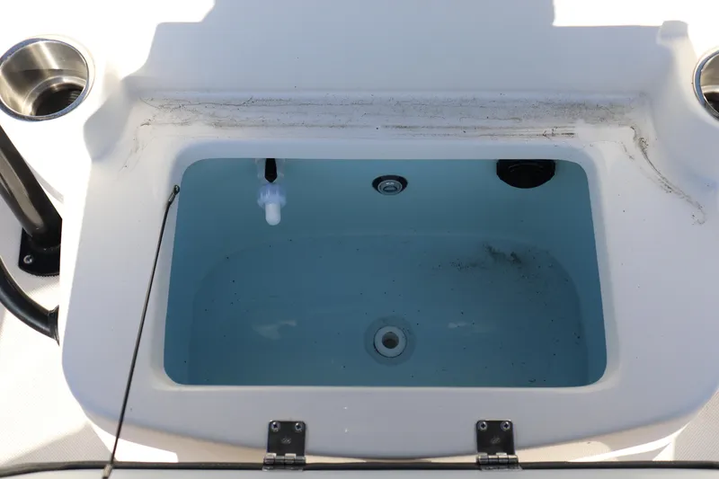 Slide: The Image of Livewell on 2024 Sea Born LX24 Center Console boat, featuring cup holders and clean design. - 5