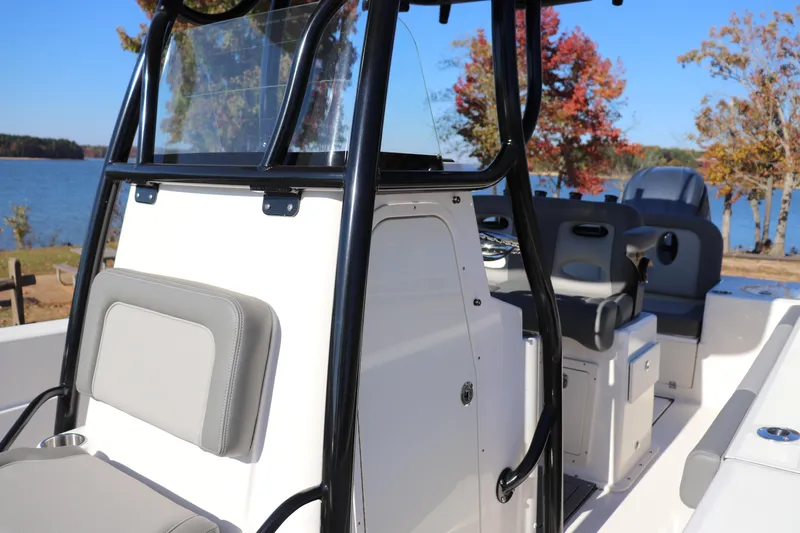 Slide: The Image of 2024 Sea Born LX24 Center Console boat interior with lake view and autumn trees. - 6
