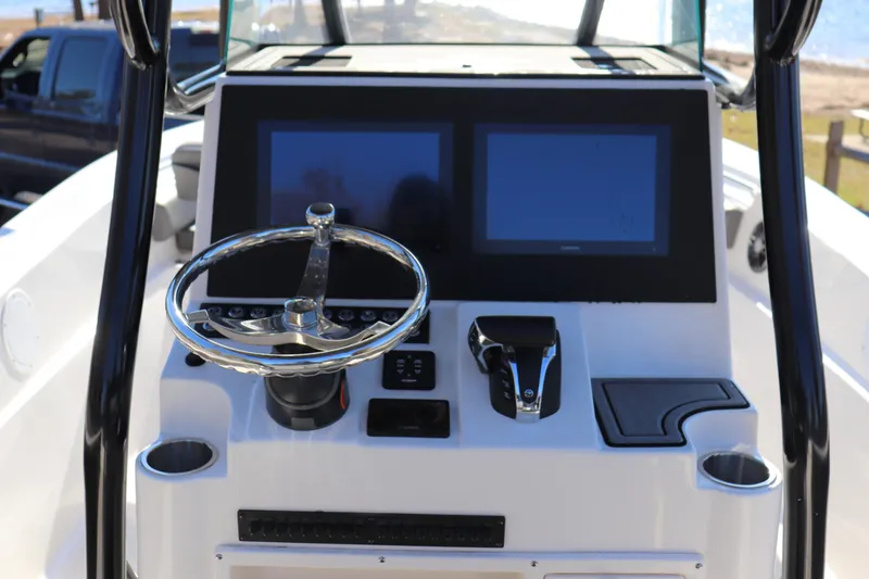 Slide: The Image of 2024 Sea Born LX24 Center Console dashboard with dual screens and steering wheel. - 8