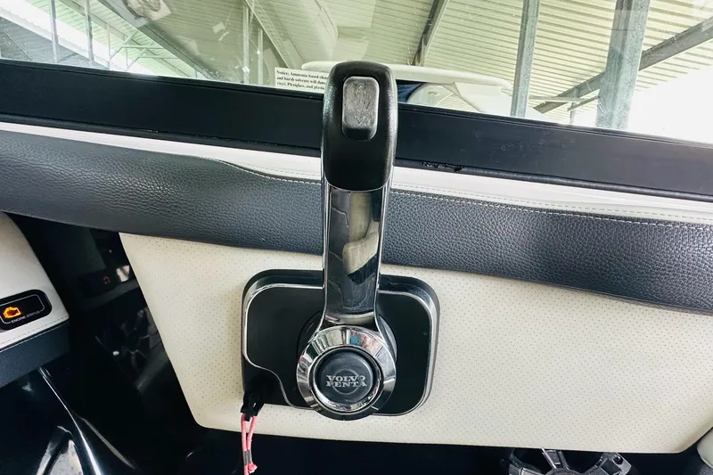 Slide: The Image of Volvo Penta throttle control on 2018 Regal 2300 Bowrider boat dashboard. - 20