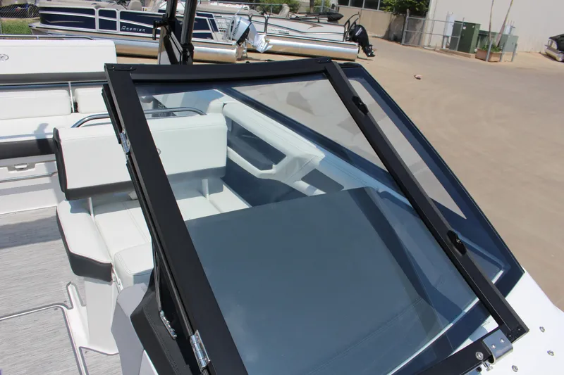 Slide: The Image of 2025 Cobalt R4 boat interior with sleek seating and modern windshield design. - 13