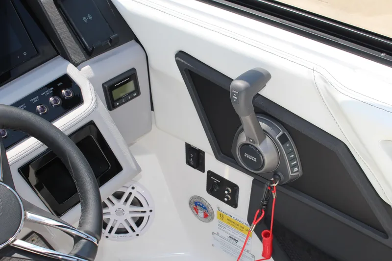 Slide: The Image of Interior of 2025 Cobalt R4 boat showing steering wheel and control panel. - 19