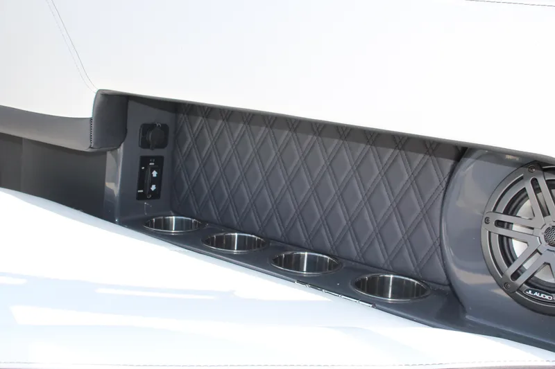 Slide: The Image of Interior of 2025 Cobalt R4 boat with cup holders and speaker system. - 24