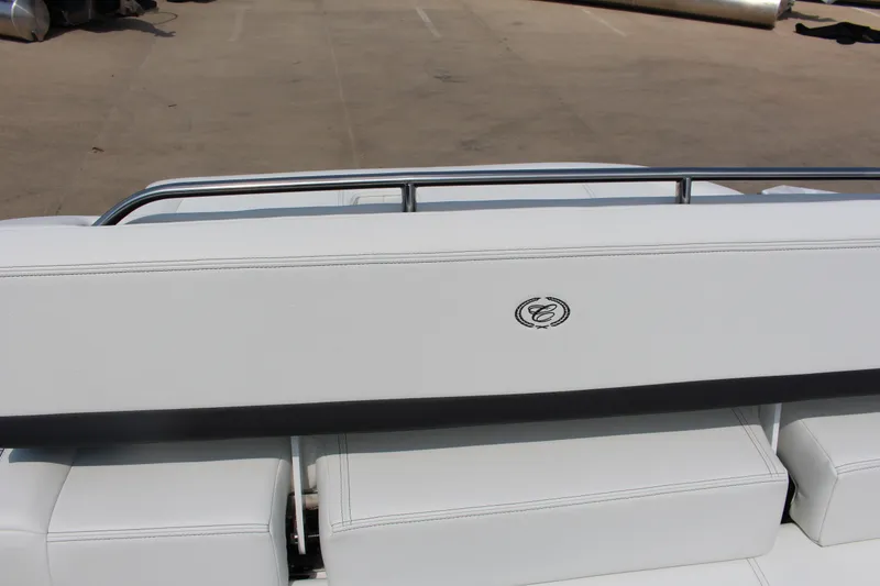 Slide: The Image of 2025 Cobalt R4 boat with white leather seating and chrome railing. - 27