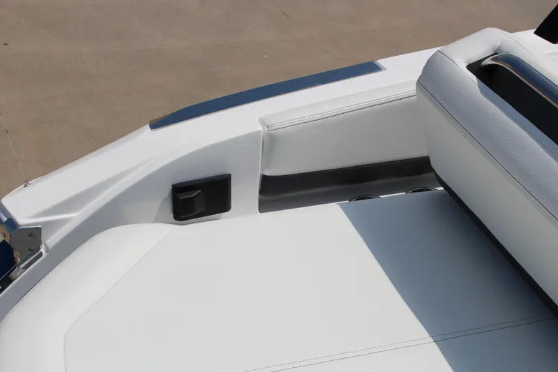 Slide: The Image of 2025 Cobalt R4 boat interior with white seating and sleek design. - 29