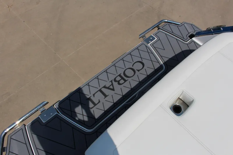 Slide: The Image of 2025 Cobalt R4 boat swim platform with logo and stainless steel accents. - 5