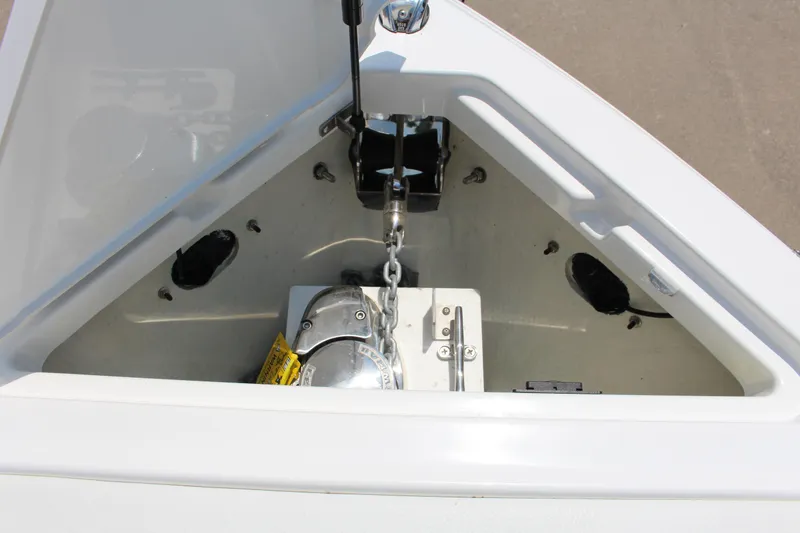 Slide: The Image of Anchor compartment of 2025 Cobalt R4 boat, featuring chain and winch system. - 9