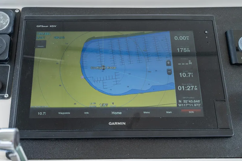 Slide: The Image of Garmin GPS display on 2002 McKinna 57 Pilothouse showing navigation and radar settings. - 17