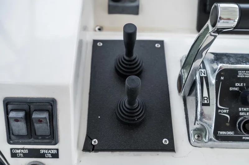 Slide: The Image of Control panel of a 2002 McKinna 57 Pilothouse yacht with joysticks and switches. - 18