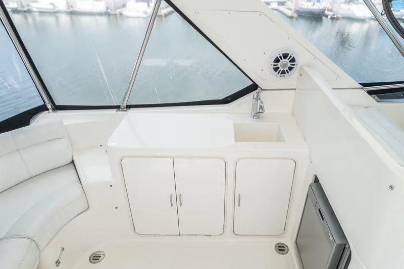 Slide: The Image of 2002 McKinna 57 Pilothouse yacht interior with sink and storage cabinets. - 22