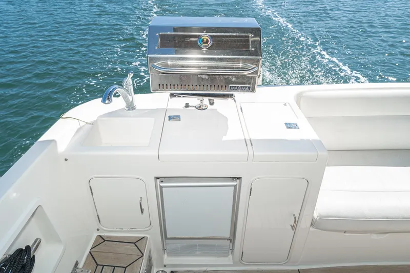 Slide: The Image of Outdoor kitchen on 2002 McKinna 57 Pilothouse yacht with grill and sink. - 27