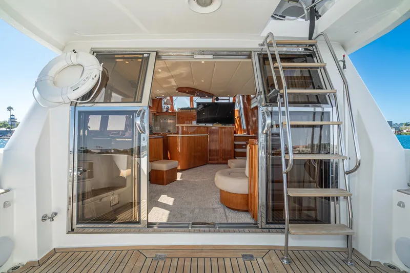 Slide: The Image of 2002 McKinna 57 Pilothouse yacht interior with elegant wood finishes and modern amenities. - 31