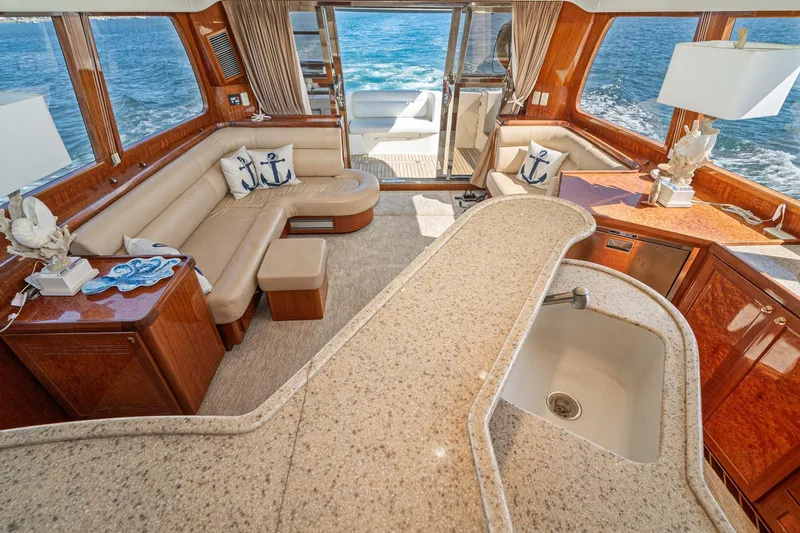 Slide: The Image of Luxurious interior of 2002 McKinna 57 Pilothouse yacht with elegant seating and ocean view. - 33