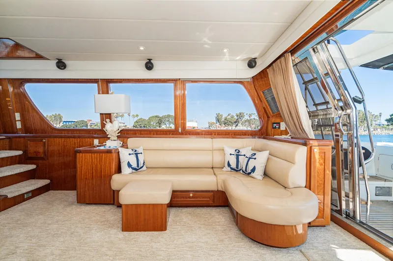 Slide: The Image of Luxurious interior of 2002 McKinna 57 Pilothouse yacht with plush seating and nautical decor. - 36
