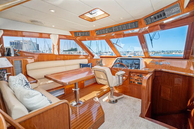 Slide: The Image of Luxurious interior of 2002 McKinna 57 Pilothouse yacht with elegant wood finish. - 40