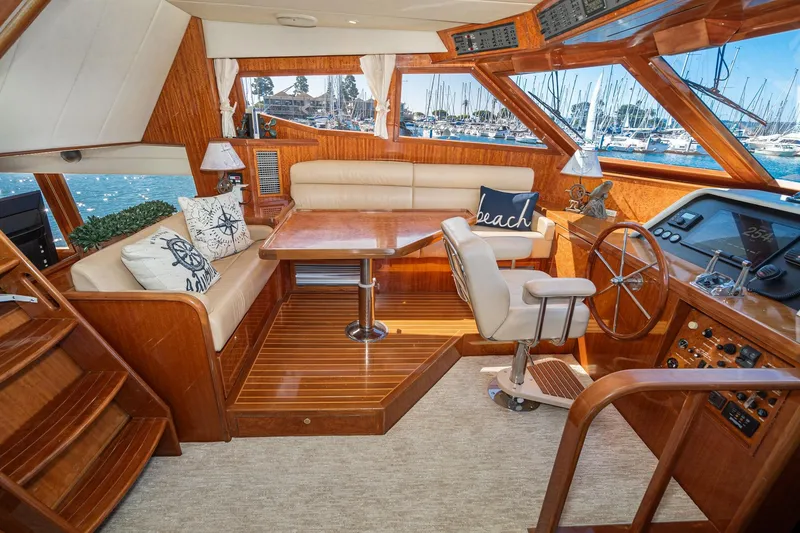 Slide: The Image of Luxurious 2002 McKinna 57 Pilothouse interior with plush seating and elegant wood finishes. - 41
