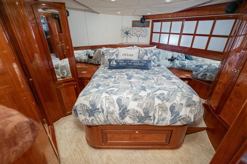 Slide: The Image of Luxurious 2002 McKinna 57 Pilothouse bedroom with elegant wood finish and cozy bedding. - 47