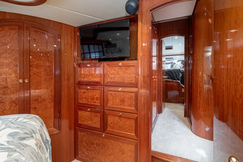Slide: The Image of Luxurious interior of 2002 McKinna 57 Pilothouse yacht with wood cabinetry and modern amenities. - 49