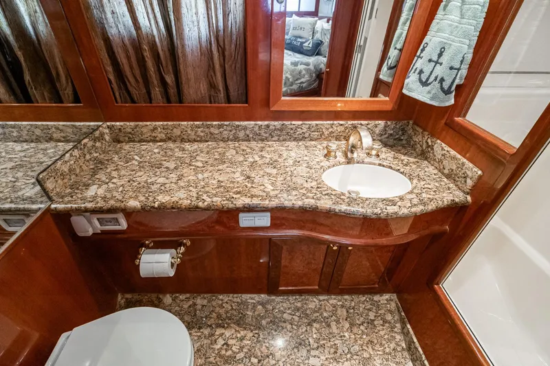 Slide: The Image of Luxurious bathroom in 2002 McKinna 57 Pilothouse yacht with granite countertop and elegant fixtures. - 51