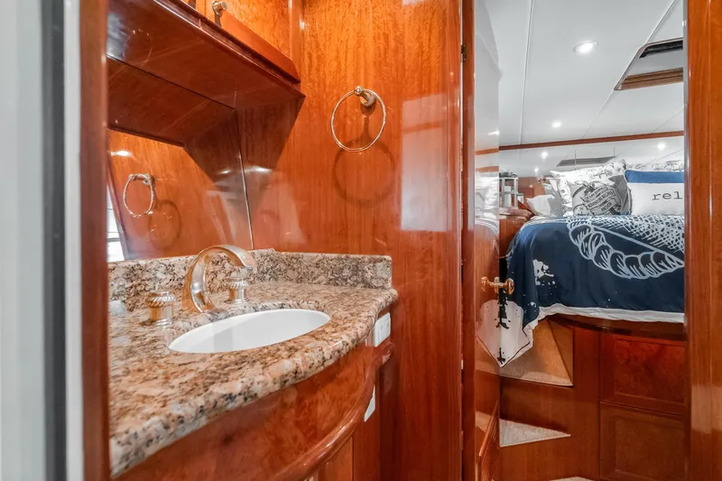 Slide: The Image of Luxurious 2002 McKinna 57 Pilothouse interior with elegant wood finish and granite sink. - 62