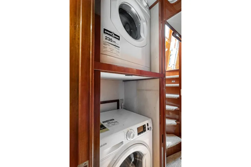 Slide: The Image of Laundry area with washer and dryer in 2002 McKinna 57 Pilothouse yacht. - 63