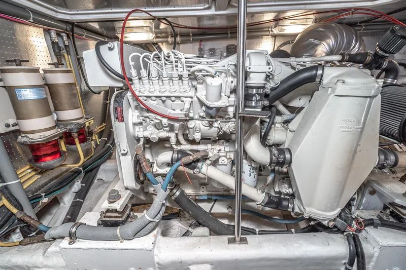 Slide: The Image of Engine room of 2002 McKinna 57 Pilothouse yacht, showcasing detailed machinery and components. - 68