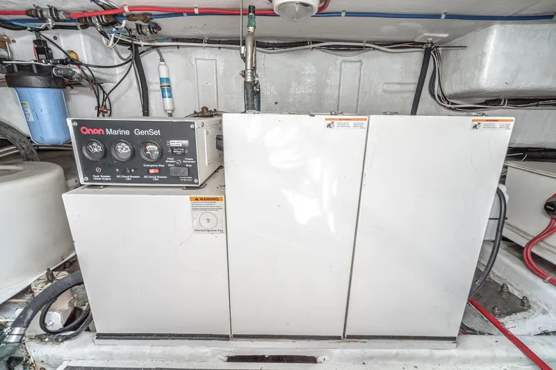 Slide: The Image of Engine room of 2002 McKinna 57 Pilothouse with Onan Marine GenSet generator. - 72