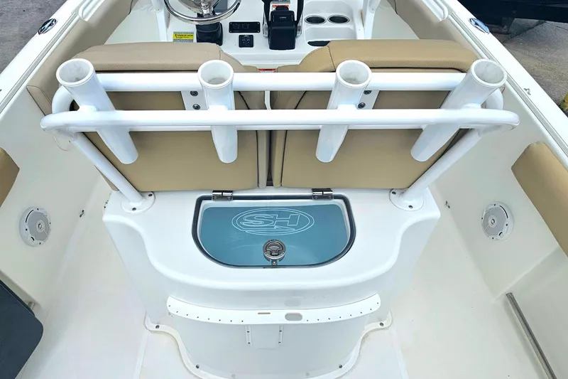 Slide: The Image of 2016 Sea Hunt Gamefish 25 interior with rod holders and seating. - 12