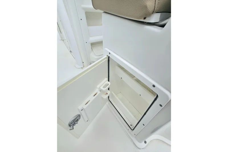 Slide: The Image of Open storage compartment on a 2016 Sea Hunt Gamefish 25 boat interior. - 14