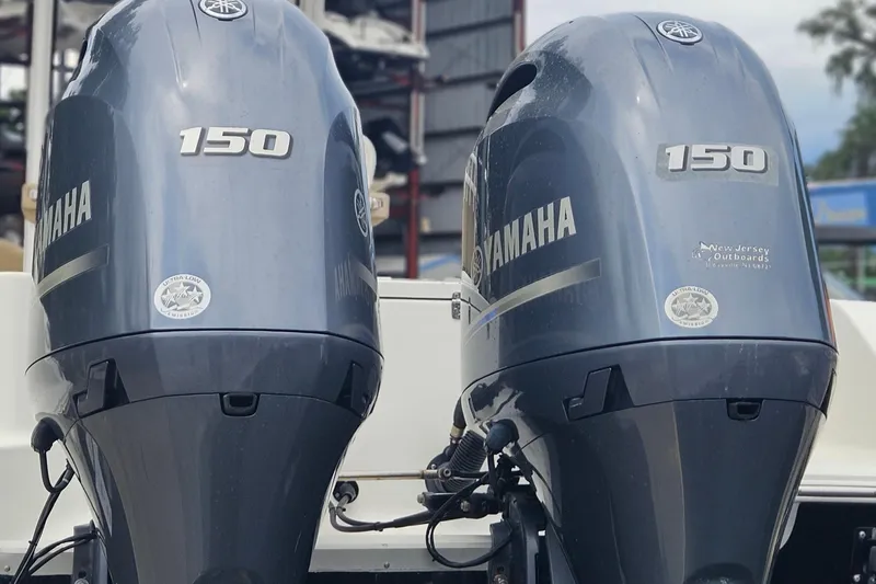 Slide: The Image of Twin Yamaha 150 outboard engines on a 2016 Sea Hunt Gamefish 25 boat. - 2