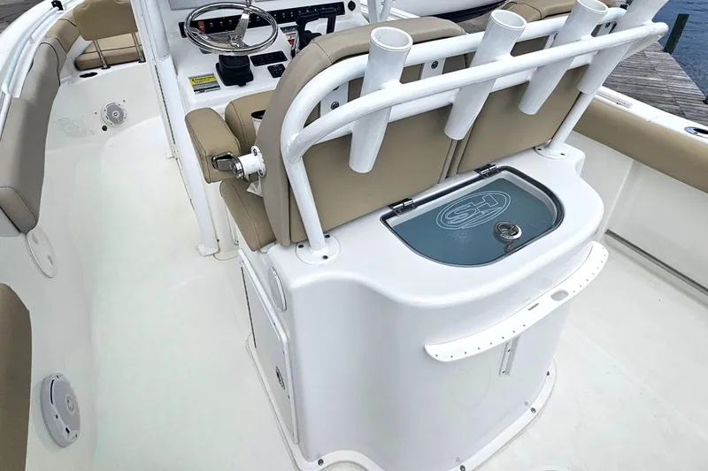 Slide: The Image of 2016 Sea Hunt Gamefish 25 boat interior with seating and rod holders. - 5