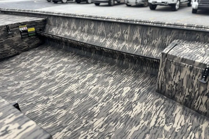 Slide: The Image of 2025 Havoc 1756 MRST boat interior with camouflage pattern and storage compartments. - 10