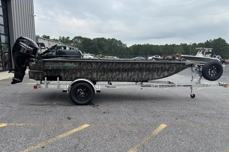 Slide: The Image of 2025 Havoc 1756 MRST boat on trailer with Mercury outboard motor. - 12