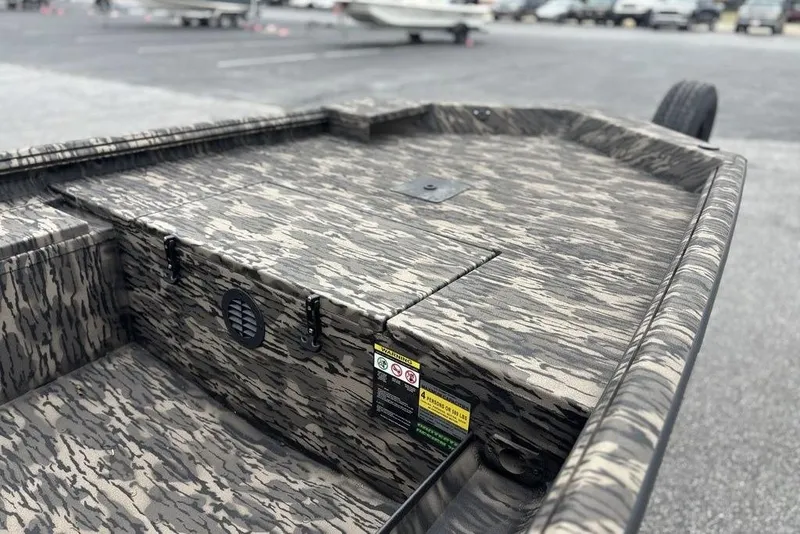 Slide: The Image of 2025 Havoc 1756 MRST boat with camouflage design in a parking lot. - 13