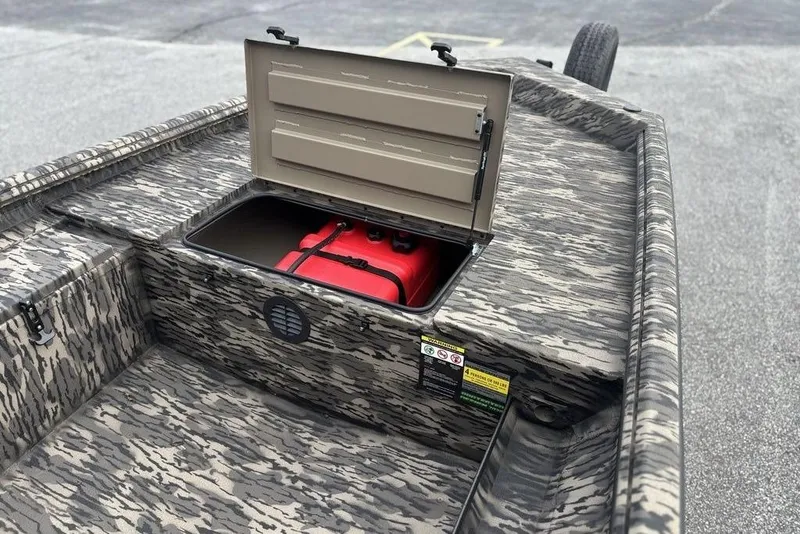 Slide: The Image of 2025 Havoc 1756 MRST boat with open storage compartment, camo design, and visible red fuel tank. - 15