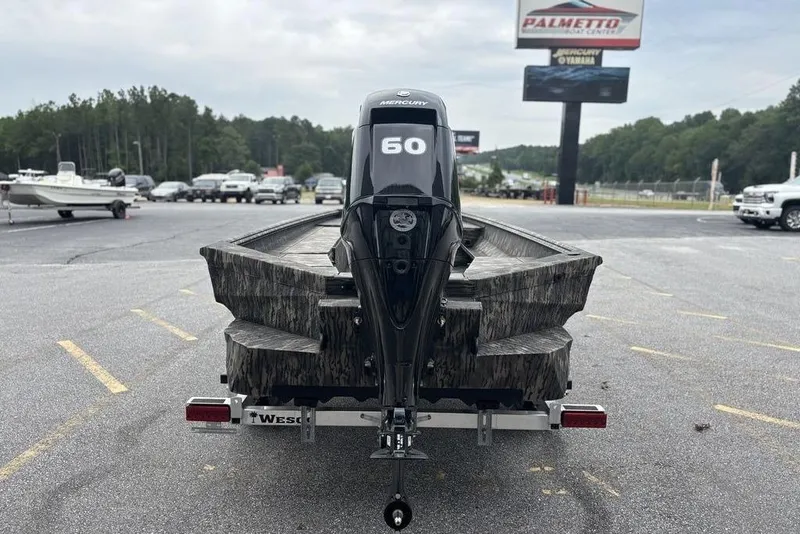 Slide: The Image of 2025 Havoc 1756 MRST boat with Mercury 60 engine on trailer in parking lot. - 4