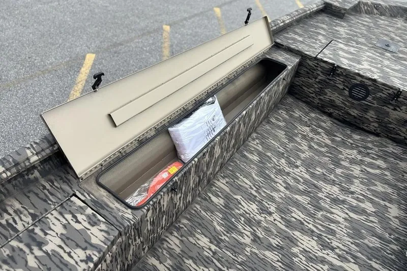 Slide: The Image of 2025 Havoc 1756 MRST boat with open storage compartment, camo pattern interior. - 5