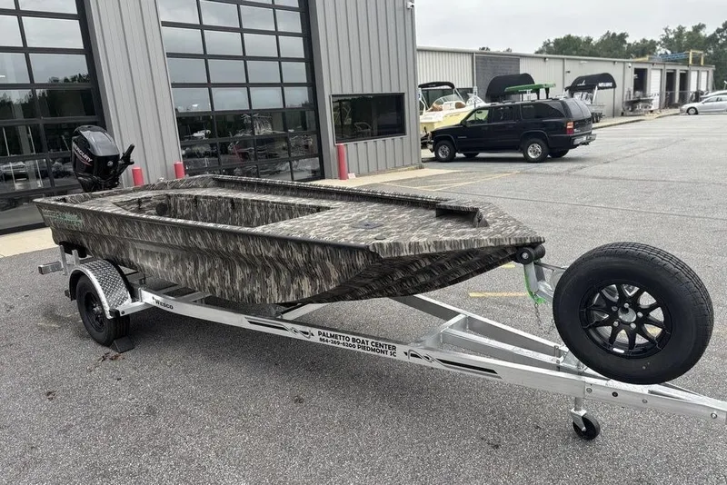 Slide: The Image of 2025 Havoc 1756 MRST boat on trailer, parked outside dealership. - 8