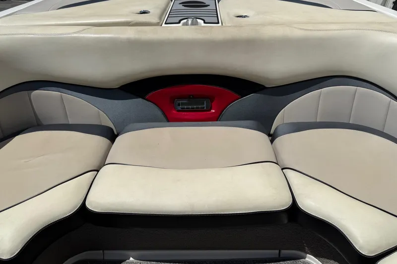 Slide: The Image of 2011 Malibu Wakesetter 23 LSV interior seating with beige and black upholstery. - 16