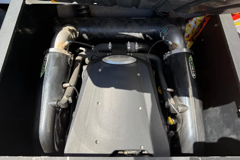 Slide: The Image of Engine compartment of a 2011 Malibu Wakesetter 23 LSV boat, showcasing mechanical components. - 19