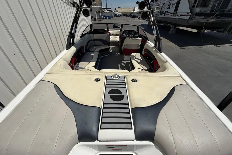 Slide: The Image of 2011 Malibu Wakesetter 23 LSV interior with spacious seating and sleek design. - 6