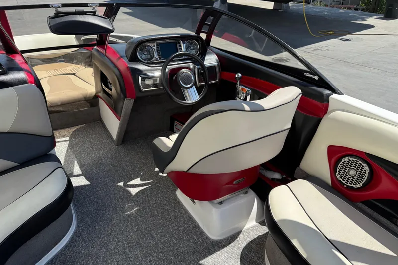 Slide: The Image of 2011 Malibu Wakesetter 23 LSV interior with modern dashboard and stylish seating. - 9