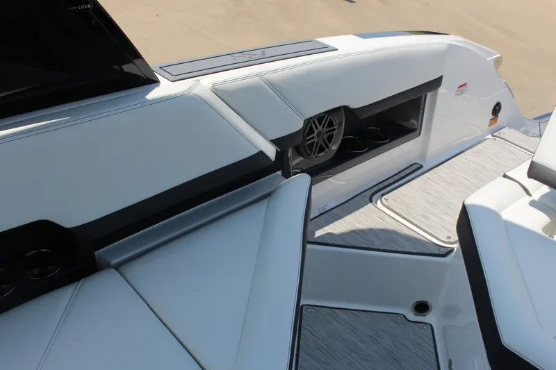 Slide: The Image of 2025 Cobalt R8 boat interior with sleek seating and integrated speaker system. - 10