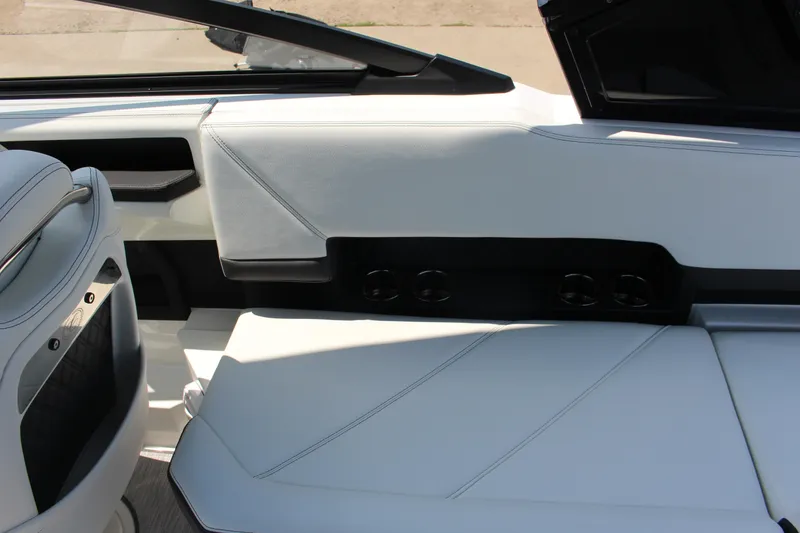 Slide: The Image of Interior of 2025 Cobalt R8 boat with sleek white seating and modern design. - 11