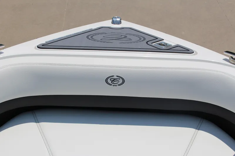 Slide: The Image of 2025 Cobalt R8 boat interior with sleek white seating and logo detail. - 13